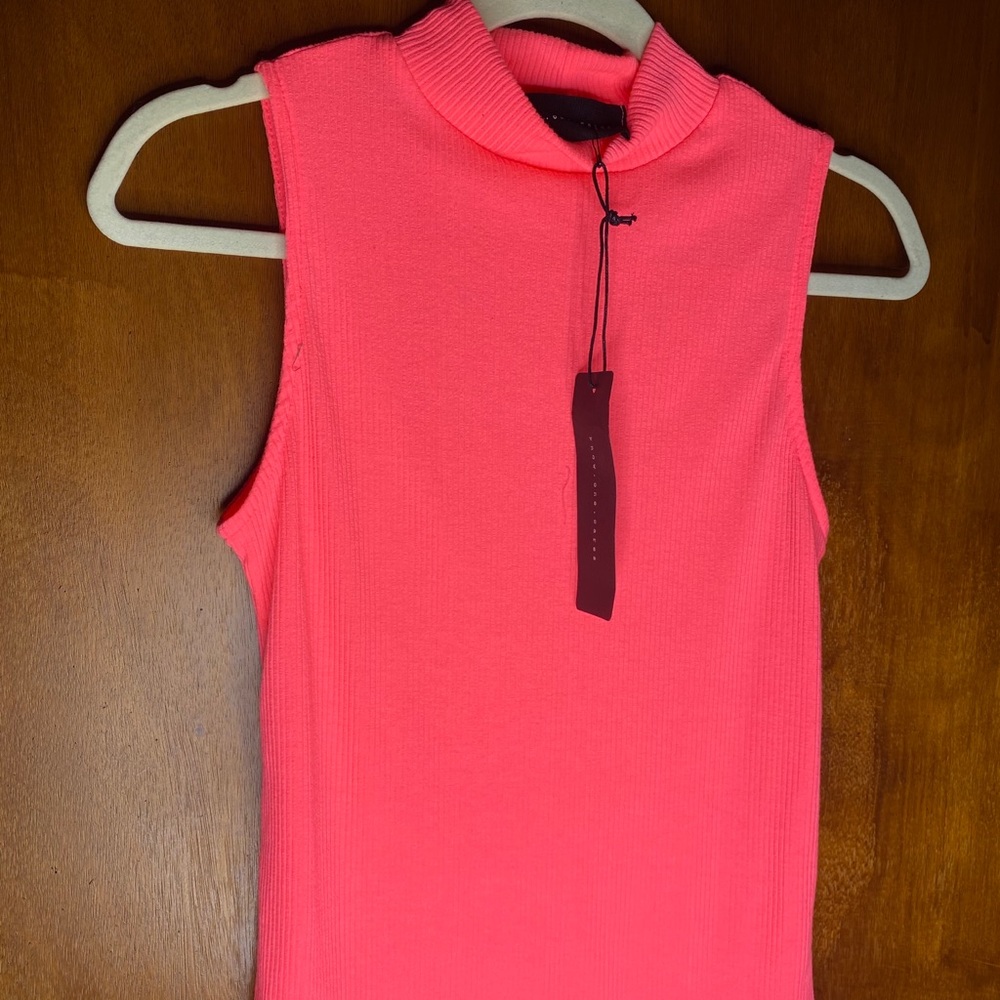 Pink sleeveless turtle neck